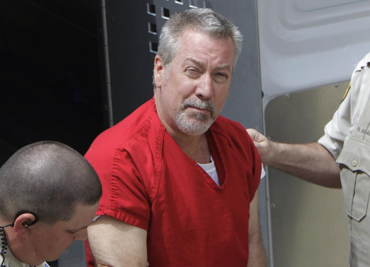 Former Bolingbrook, Ill., Police Sgt. Drew Peterson arrives at court in 2009 for his arraignment in the death of his third wife.