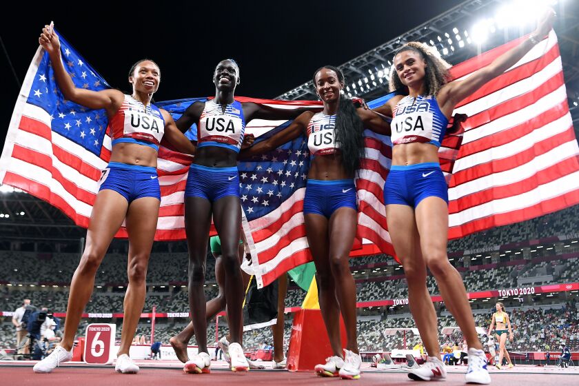 -TOKYO,JAPAN August 7, 2021: USA team members pose for photos after winning the gold medal in the 4X400 relay at the 2020 Tokyo Olympics. (Wally Skalij /Los Angeles Times)