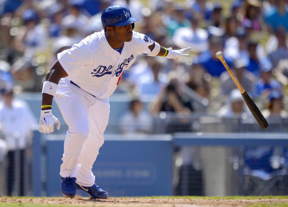 Dodgers right fielder Yasiel Puig hits a double during the seventh inning Sunday against the Atlanta Braves.