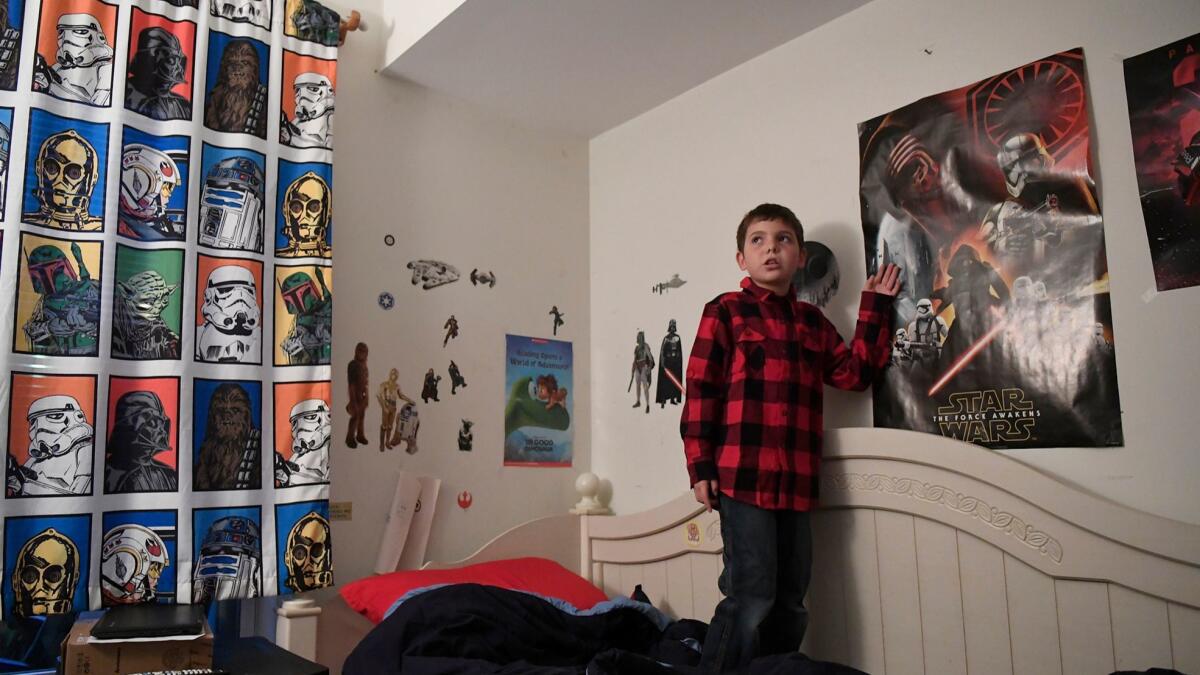 In this Dec. 13, 2016, photo, Joe Maldonado, 8, stands in his room in Secaucus, N.J., earlier this month.