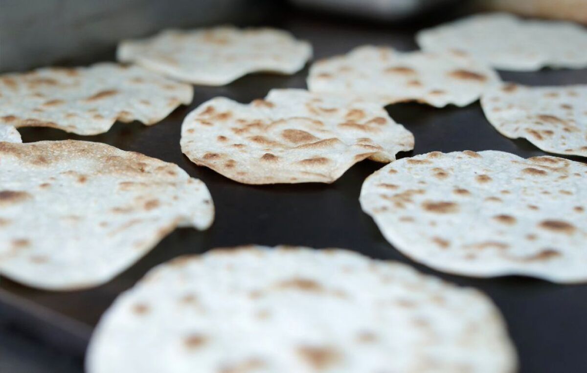 Handmade flour tortillas are grilled for vampiros at the Asadero Chikali truck.