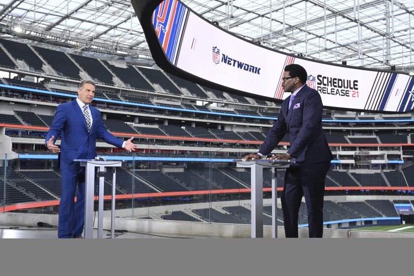NFL Network's Kurt Warner, left, and Michael Irvin discuss the release of the NFL 2021-22 schedule in May 2021.