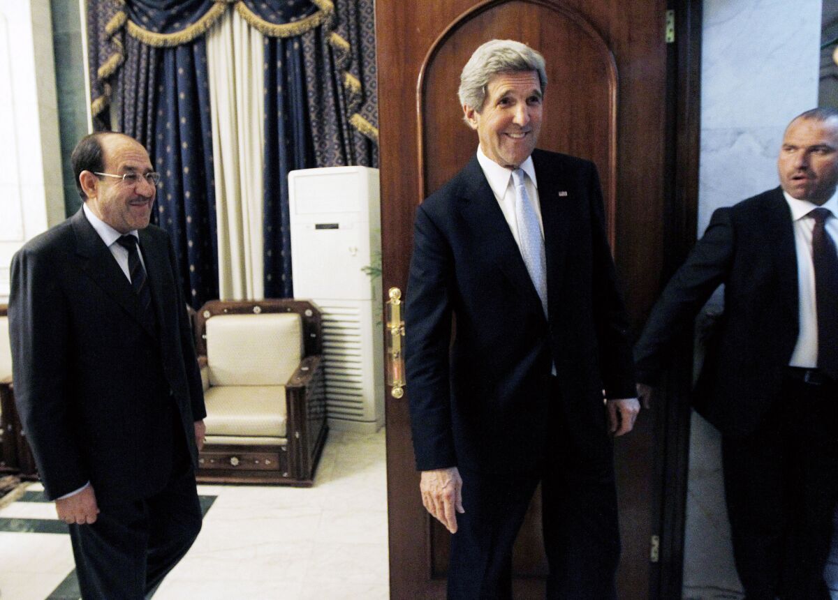 U.S. Secretary of State John Kerry after meeting with Iraqi Prime Minister Nouri Maliki, left, in Baghdad on Sunday.