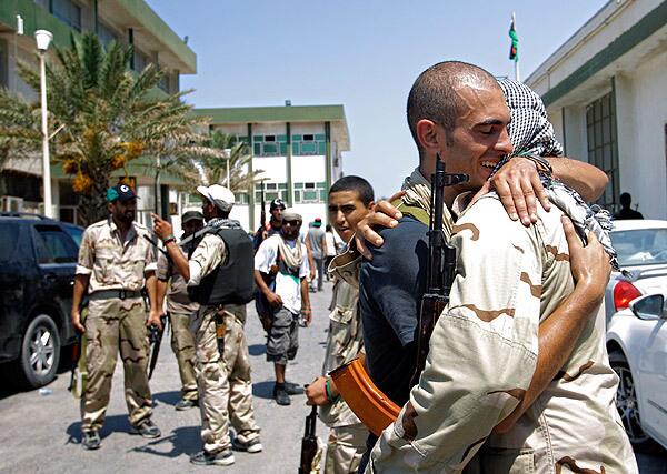 Rebel fighters embrace