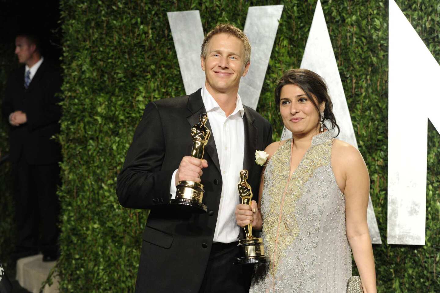 Daniel Junge, left, and Sharmeen Obaid-Chinoy with their documentary short Oscars for "Saving Face."