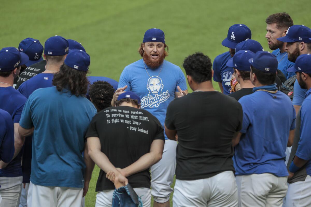 Dodgers third baseman Justin Turner speaks to his teammates during a team practice session on Monday.