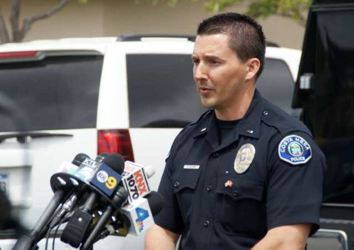 Then-Lt. Bryan Glass updates media during a 2013 news conference in Costa Mesa. 