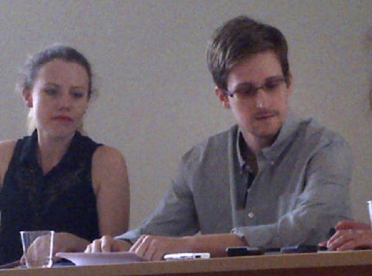 WikiLeaks advisor Sarah Harrison meets with Edward Snowden at Sheremetyevo International Airport in Moscow. The anti-secrecy group hailed its victory in helping Snowden obtain asylum in Russia, but human rights groups warn the American fugitive has landed in a country intolerant of free speech and dissent.