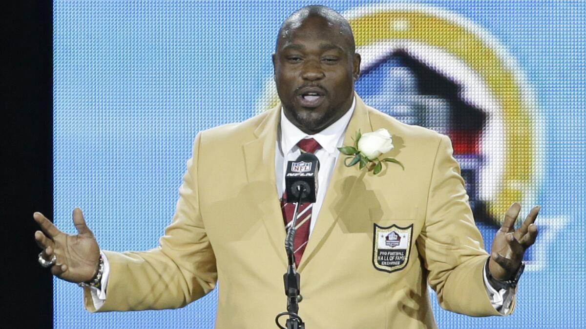 Former NFL defensive tackle Warren Sapp speaks during his induction into the Pro Football Hall of Fame in Canton, Ohio, on Aug. 3, 2013.