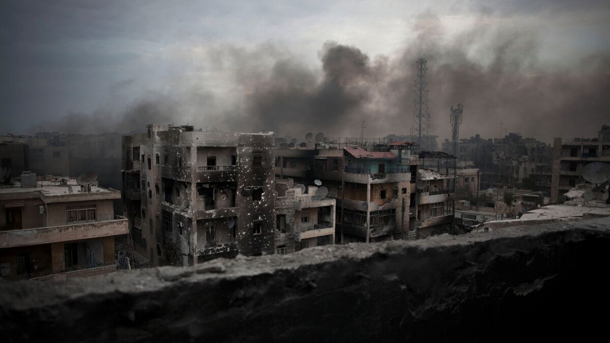 Smoke rises over Aleppo, Syria, in 2012. Asked what he would do, if elected, "about Aleppo," presidential candidate Gary Johnson responded: "What is Aleppo?"