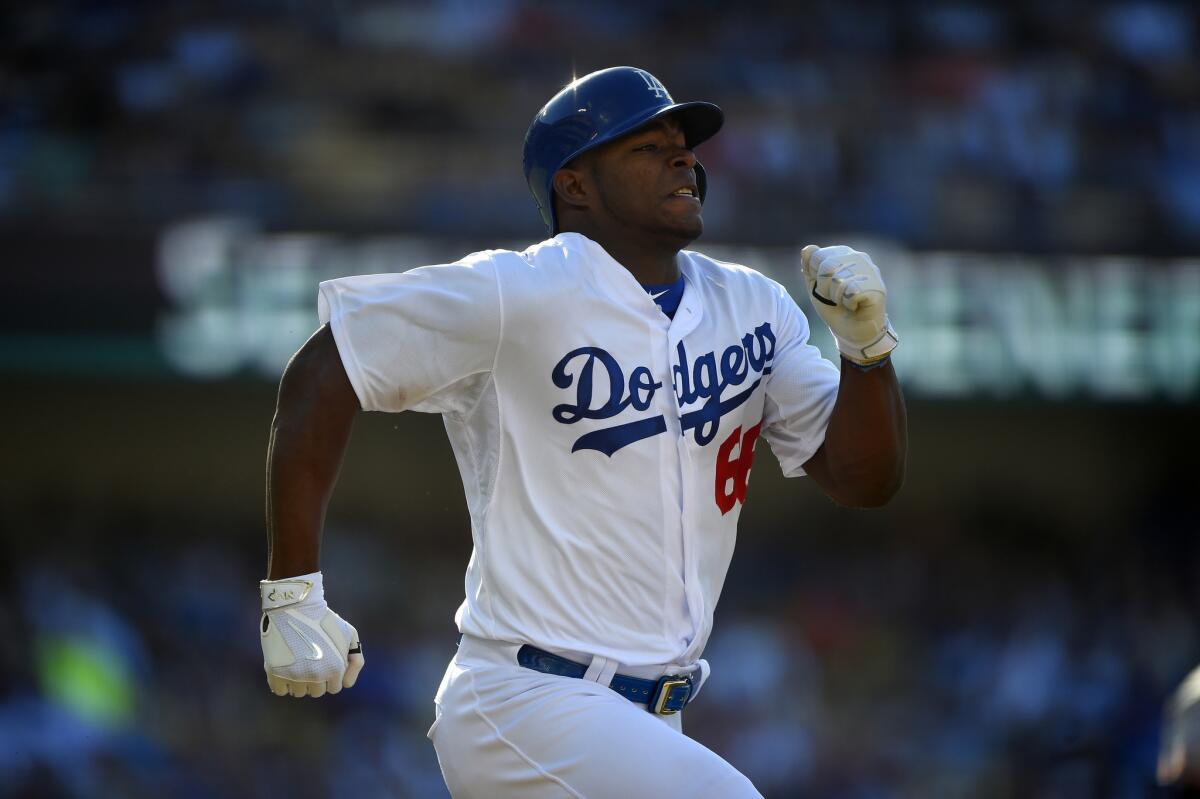 Dodgers outfielder Yasiel Puig runs to first base during a game against the San Francisco Giants on June 20.
