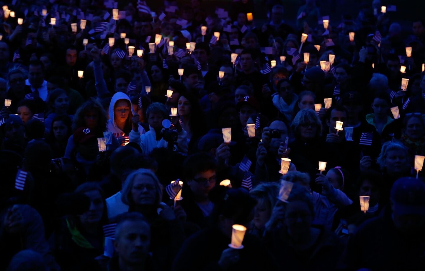 Participants at a candlelight vigil Tuesday for Boston Marathon bombing victim Martin Richard, 8, include residents of his Dorchester neighborhood.