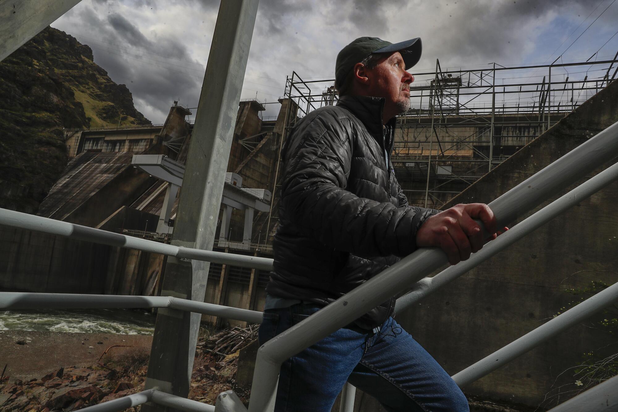 A man climbs stairs at Hells Canyon Dam on the Snake River.