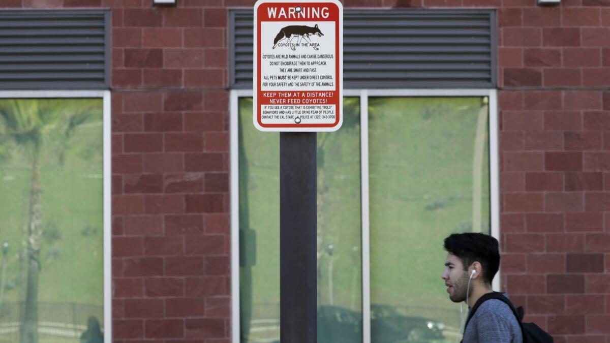 Warning signs are posted on the Cal State L.A. campus.