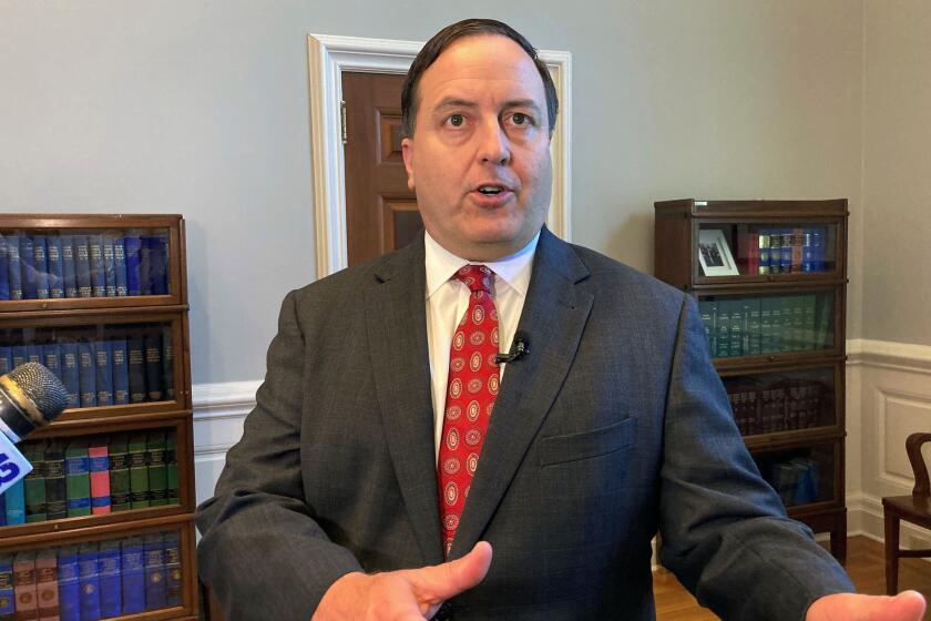 FILE - Missouri Secretary of State Jay Ashcroft speaks to reporters on June 29, 2022, at his Capitol office in Jefferson City, Mo. In an interview, Ashcroft said he wants the Electronic Registration Information Center, a voluntary system known as ERIC, to drop a requirement for member states to send mailings to eligible but unregistered voters. “It needs to be focused on cleaning rolls,” Ashcroft said. (AP Photo/David A. Lieb, File)