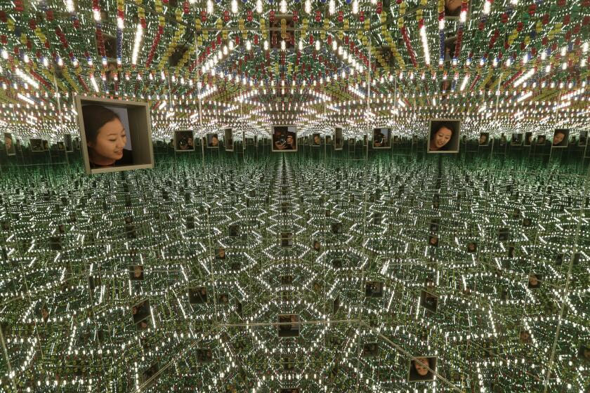 Looking into "Infinity Mirrored Room — Love Forever," 1994, one of the artist's six rooms in the exhibition "Yayoi Kusama: Infinity Mirrors" at the Broad museum in downtown L.A.