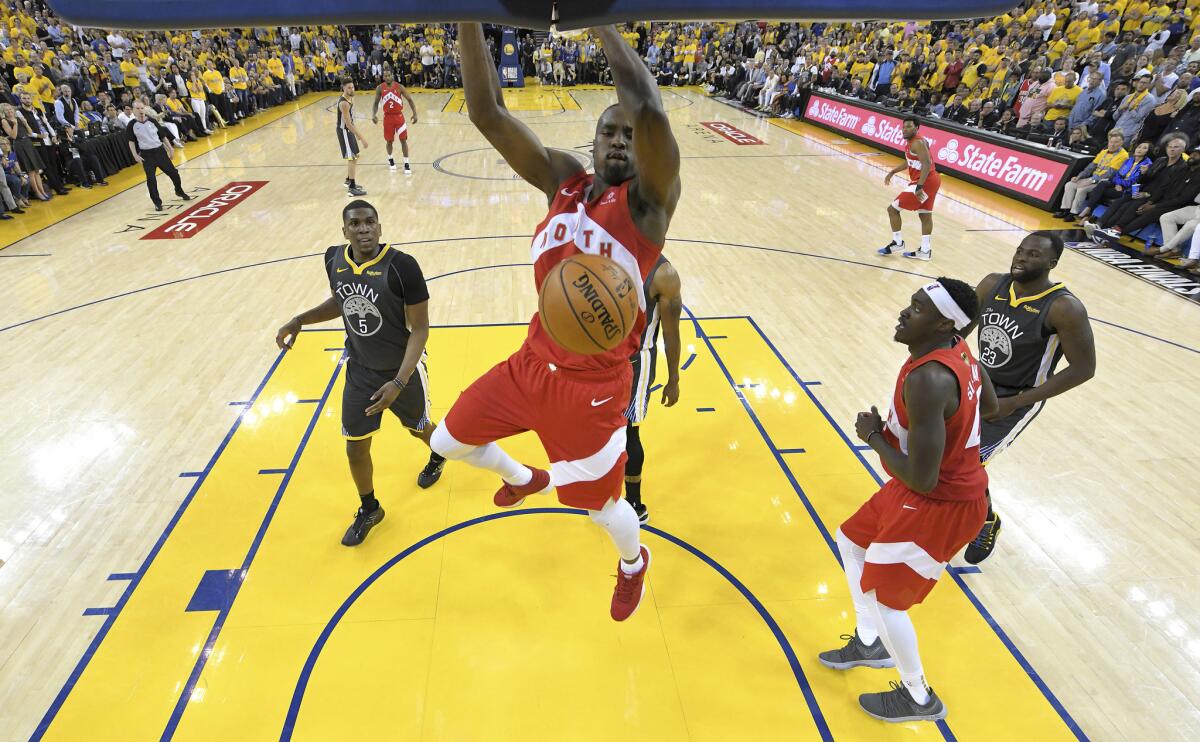 Toronto Raptors center Serge Ibaka dunks against the Golden State Warriors during the second half of Game 4 of basketball's NBA Finals in Oakland, Calif., Friday, June 7, 2019.