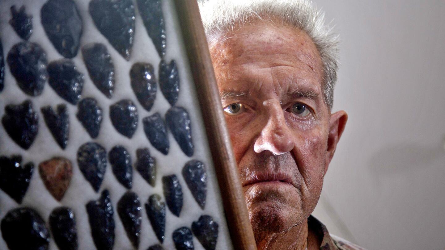 Lone Pine resident Norman Starks, 76, with a framed collection of arrowheads at his Lone Pine home.