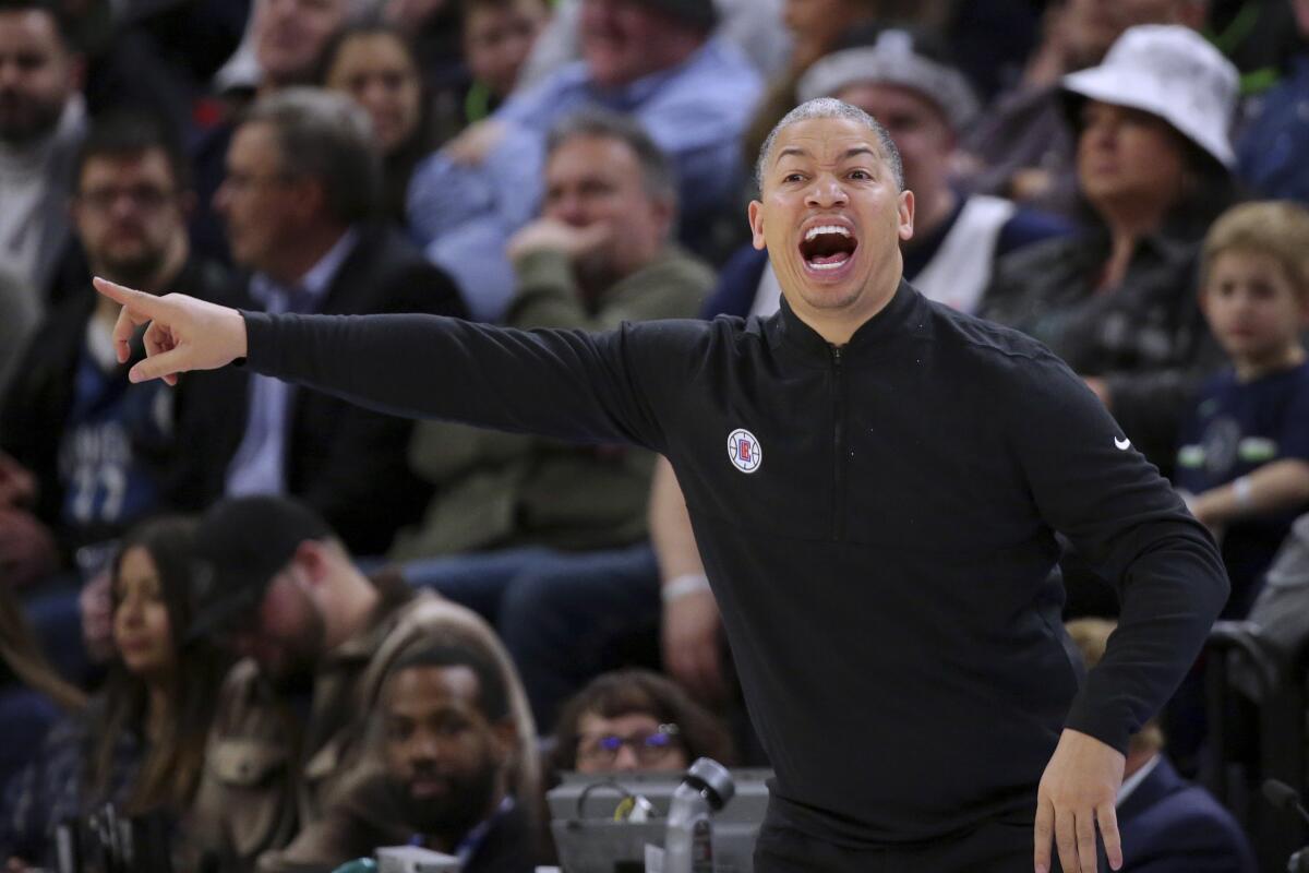 Clippers coach Tyronn Lue directs players during the fourth quarter against the Minnesota Timberwolves on Jan. 6, 2023.