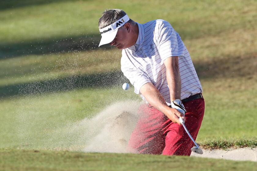 Paul Goydos hits from a greenside bunker at the 18th hole during the final round of the Toshiba Classic at the Newport Beach Country Club on Sunday.
