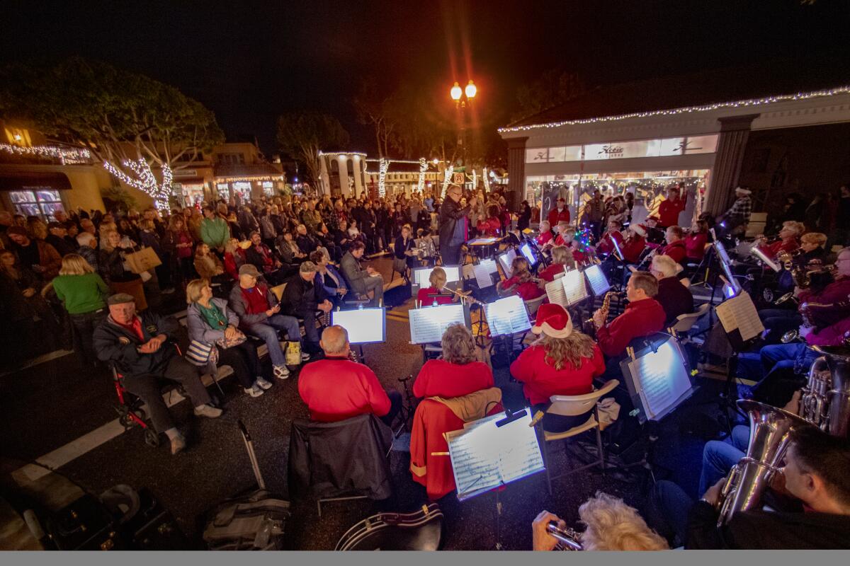 Mark Lowery, the band's musical director, conducts the Laguna Community Concert Band at the city's Hospitality Night last year. 
