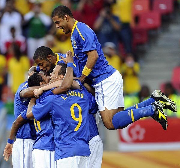 Brazil celebrates after striker Robinho scores the opening goal during the 2010 World Cup quarterfinal on Friday. Netherlands beat Brazil 2-1.