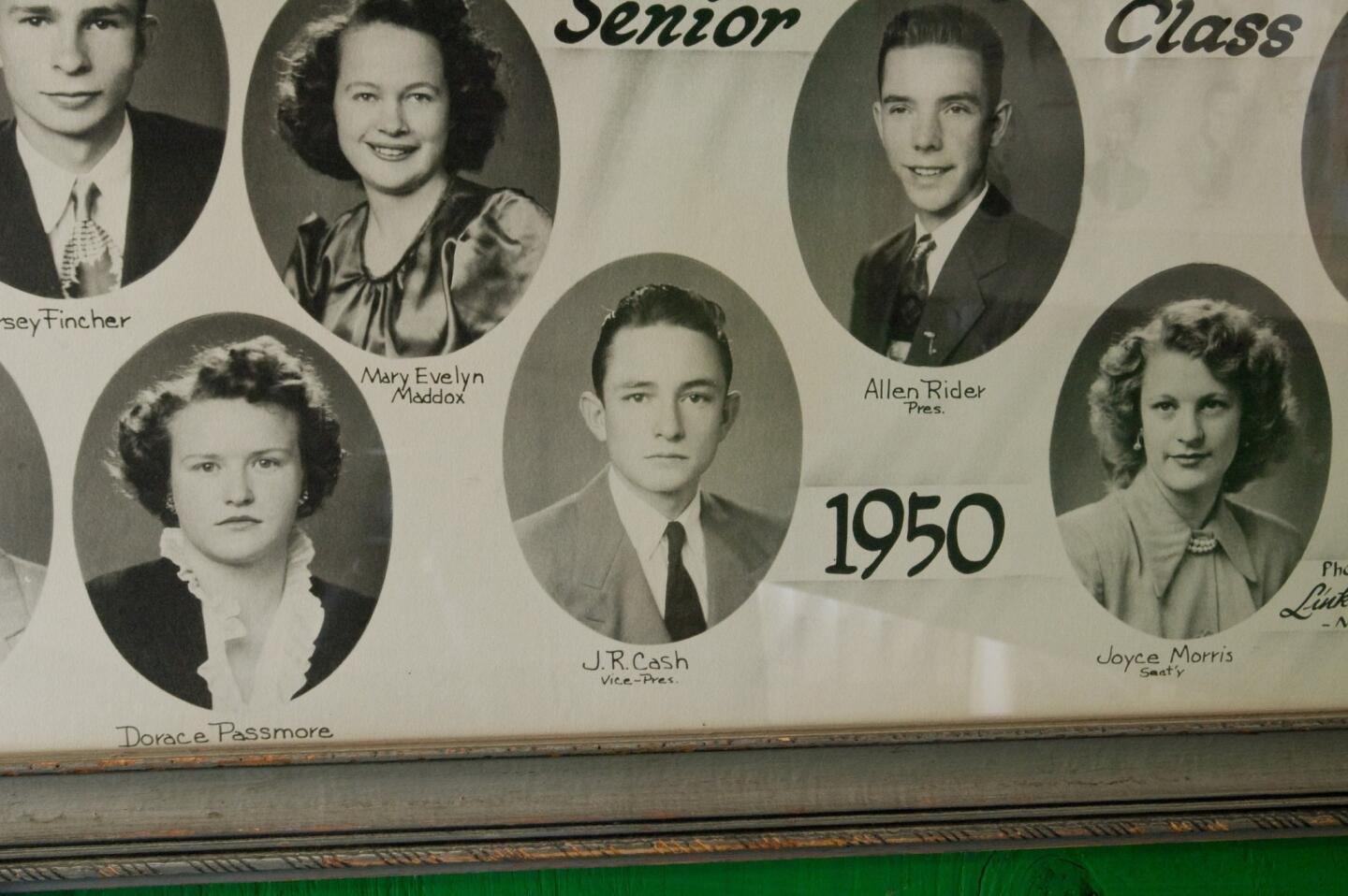 Johnny Cash grew up in Arkansas as J.R. Cash. He worked on the family farm through the Great Depression, joined the Air Force and got married before pursuing a professional career in music. His hobby of singing and songwriting became a job in 1955, when he signed with Sun Records. Above, Cash is pictured, center, in his senior high school photo.