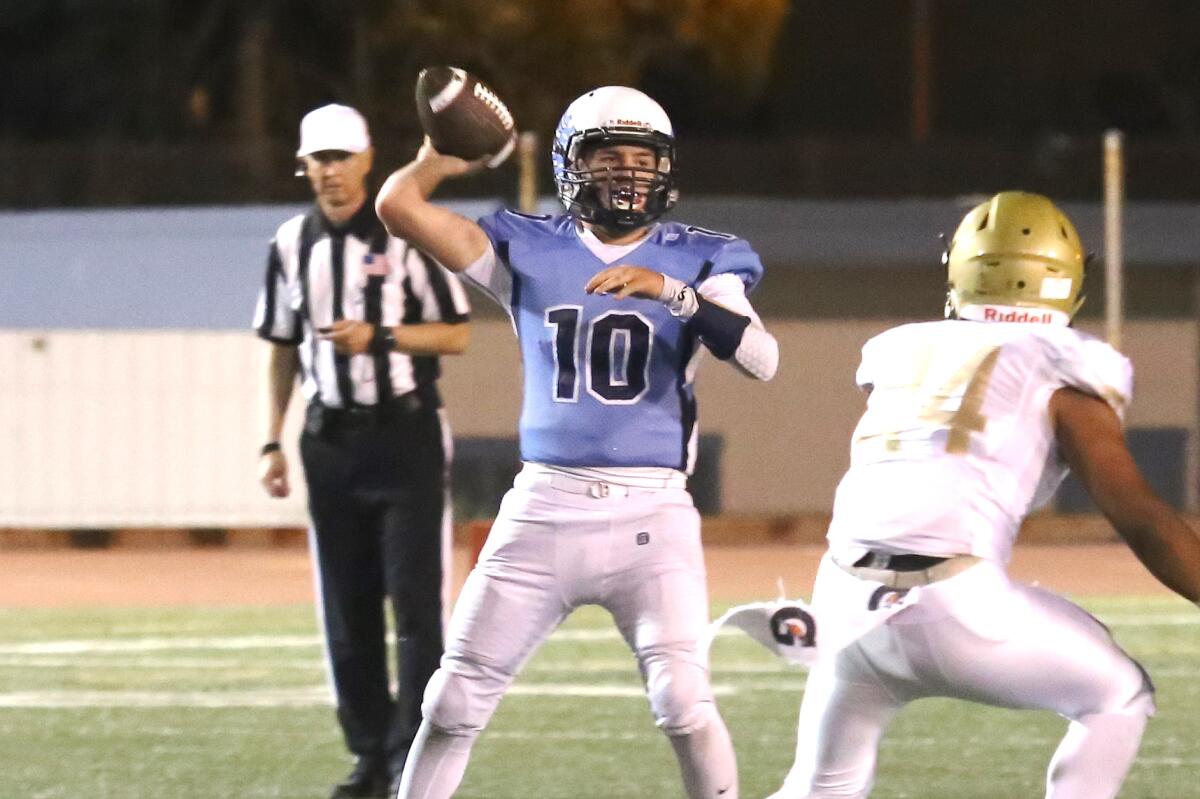 Crescenta Valley High quarterback Chase Center drops back to pass during Friday night's Pacific League game against Muir.