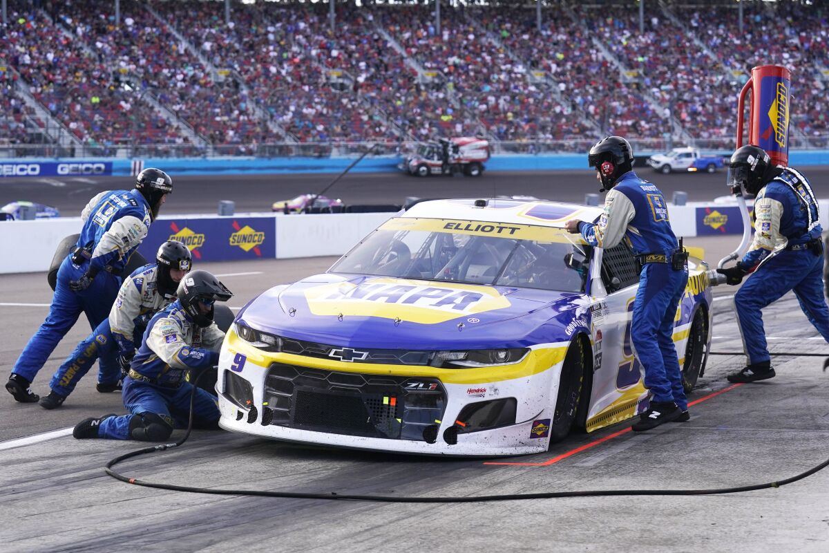 Chase Elliott makes a pit stop during a NASCAR Cup Series auto race on Sunday, Nov. 7, 2021, in Avondale, Ariz. (AP Photo/Rick Scuteri)