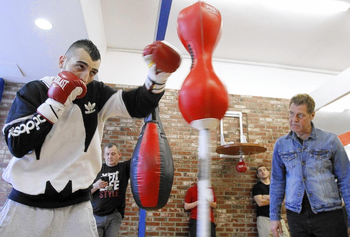 With trainer Joe Goosen keeping a close watch at right, Glendale boxer Vanes Martirosyan trains at Ten Goose Boxing gym in Van Nuys on Tuesday, March 11, 2014. Martirosyan is preparing for an upcoming fight against Mario Alberto Lozano on Friday, March 21, 2014.
