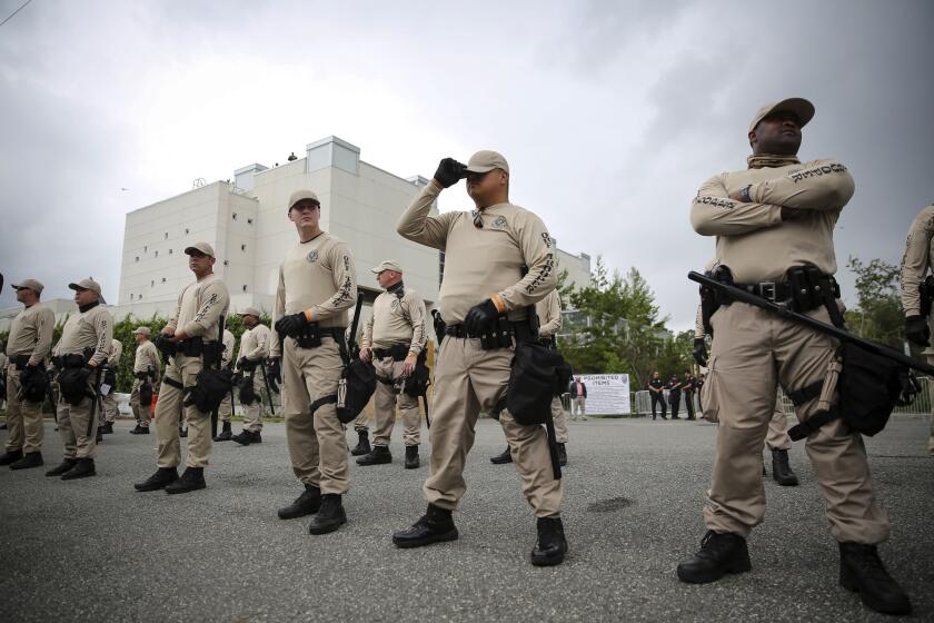 In this Oct. 19, 2017 photo, Troopers with the Florida Highway Patrol Quick Response Force line in front of the Phillips Center on the University of Florida campus in Gainesville, Fla., ahead of white nationalist Richard Spencer's speech, White supremacist propaganda circulated on college campuses nearly doubled in 2019, according to a report by the Anti-Defamation League published Wednesday, Feb. 12, 2020. (Will Vragovic/Tampa Bay Times via AP)