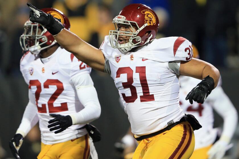 USC's Soma Vainuku celebrates his blocked punt against Colorado, which led to a safety for the Trojans.