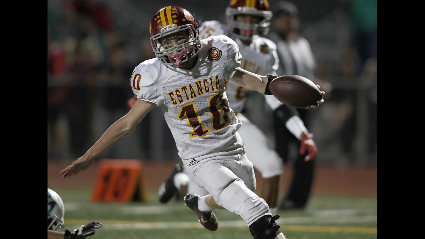 Estancia High's Trevor Pacheco (10) scores a touchdown against Costa Mesa during the first half in the Battle for the Bell football game on Friday, Oct. 20.