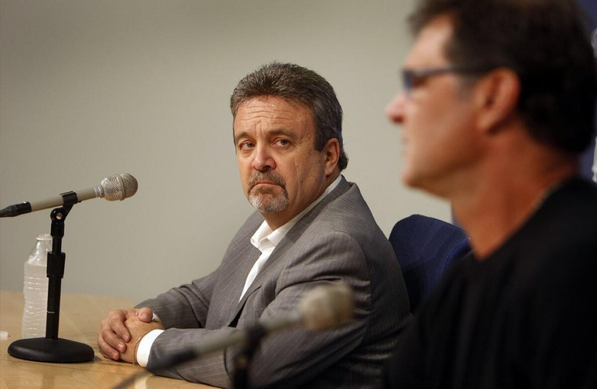 Dodgers general manager Ned Colletti, left, and Dodgers manager Don Mattingly speak to the media on October 21.