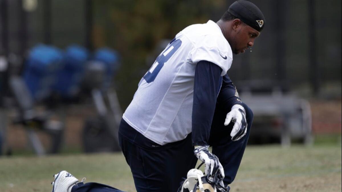 Defensive end Quinton Coples catches his breath during OTAs with the Rams in Oxnard on June 1.