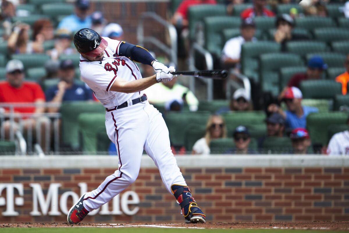 Atlanta Braves' Adam Duvall hits a solo home run in the second inning of a baseball game against the Pittsburgh Pirates, Sunday, June 12, 2022, in Atlanta. (AP Photo/Hakim Wright Sr.)