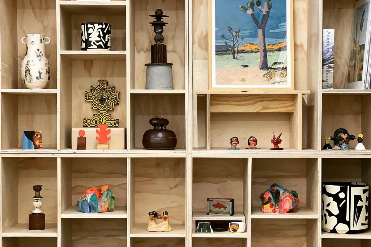 Ceramic sculptures and artworks on shelves 