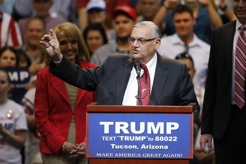 Maricopa Country Sheriff Joe Arpaio introduces Republican presidential candidate Donald Trump at a Tucson campaign rally in March.