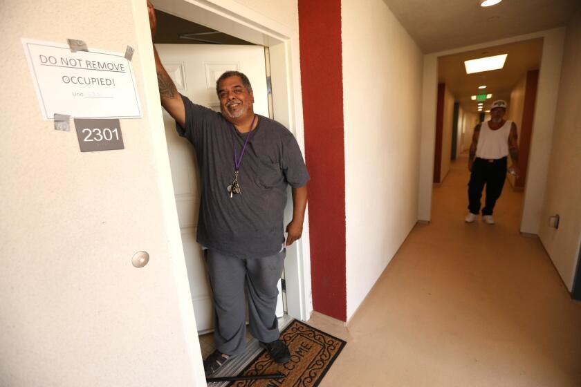 Terrence Horsley, 51, who was formally homeless for seven years, now lives at the new Donald & Priscilla Hunt Apartments in Bell, Calif. The Salvation Army dedicated the apartments Thursday.