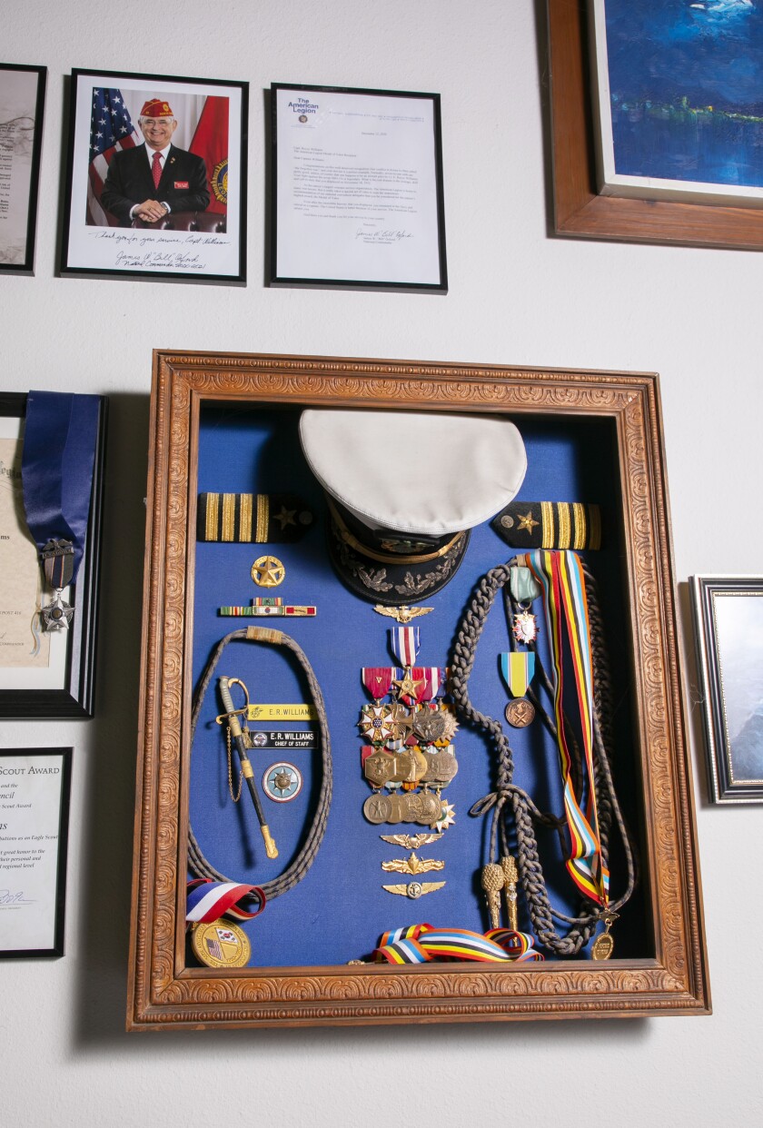 A trophy box with military decorations hangs on the wall of E. Royce Williams's house in Escondido. 