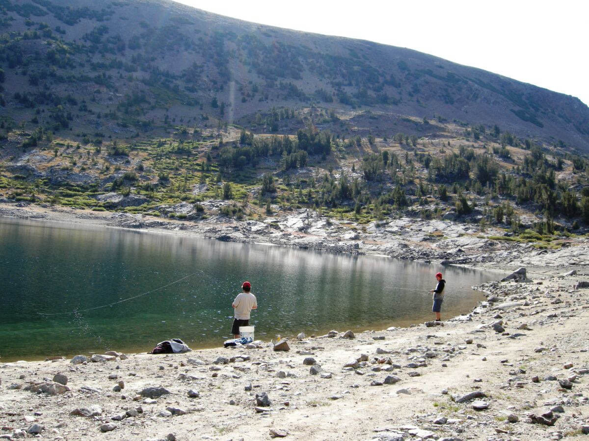 Two anglers stake their spots on the banks of Saddlebag Lake. Some California anglers and hunters are upset about what they believe is a lack of representation on the state Fish and Wildlife Commission.
