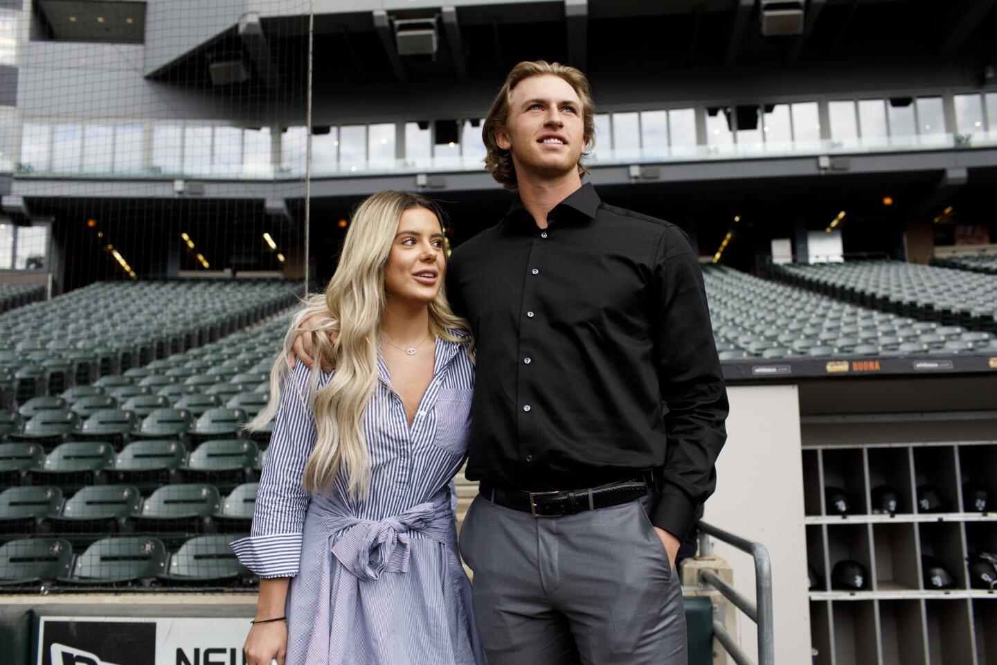 Brielle Biermann and Michael Kopech stand on the field at Guaranteed Rate Field before a White Sox game on Sept. 6, 2017.
