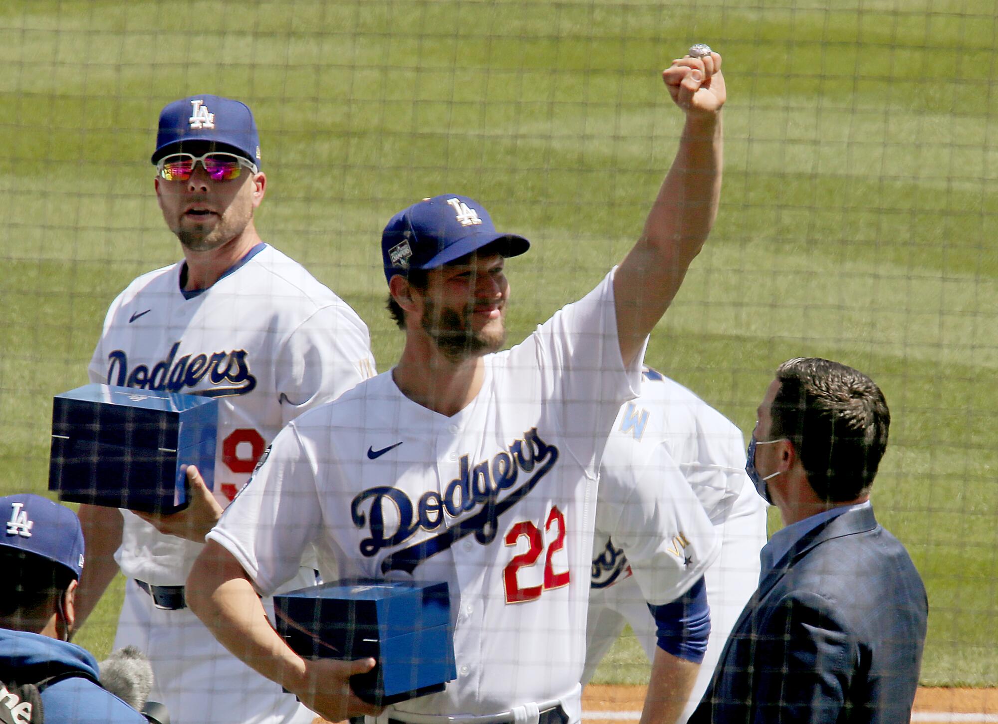 Dodgers pitcher Clayton Kershaw celebrates after getting his championship ring on April 9, 2021.