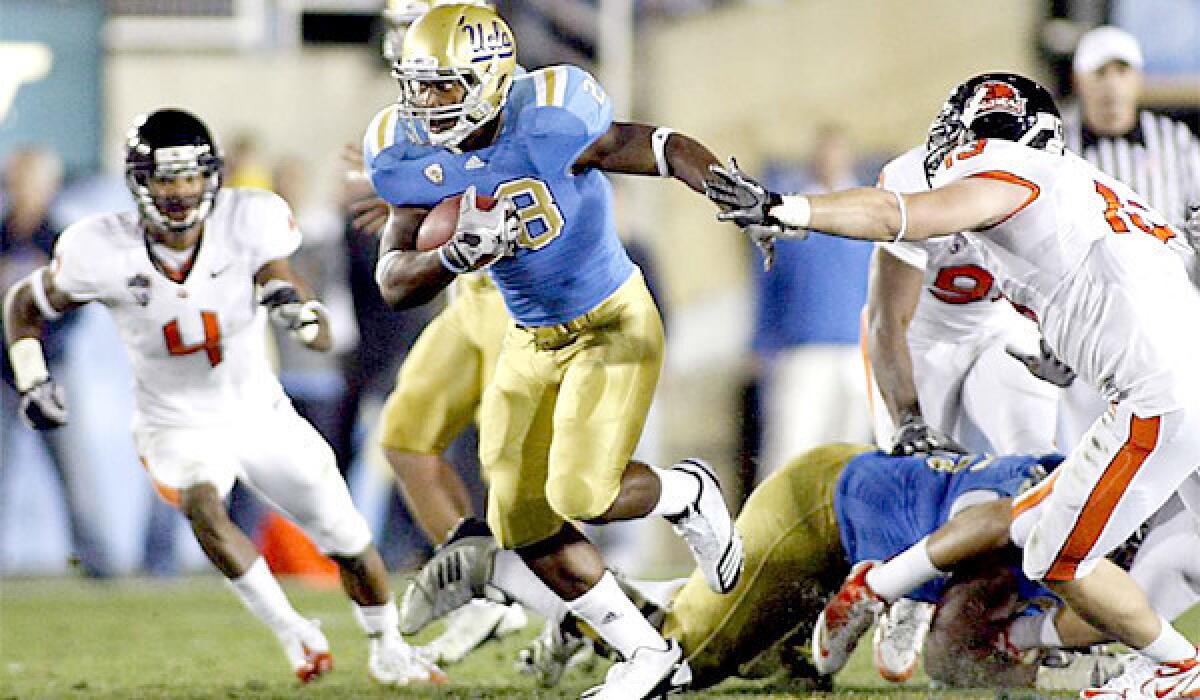 Running back Malcolm Jones, who left UCLA last fall, will return to the Bruins football program as a walk-on, according to Coach Jim Mora.