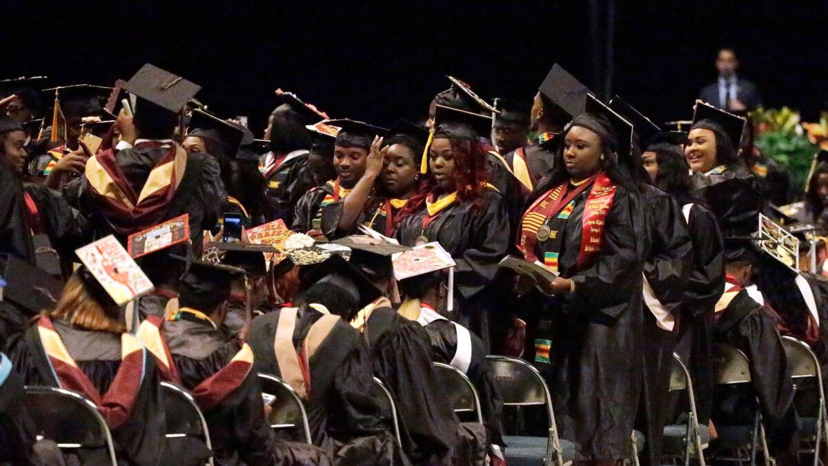 Students at Bethune-Cookman University in Florida turn their backs on commencement speaker Education Secretary Betsy DeVos.