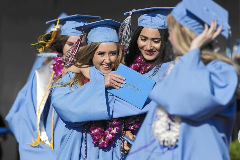 Happy graduates revel on the red carpet after getting their diplomas during the 53rd annual commencement ceremony at Corona del Mar High School on Thursday.