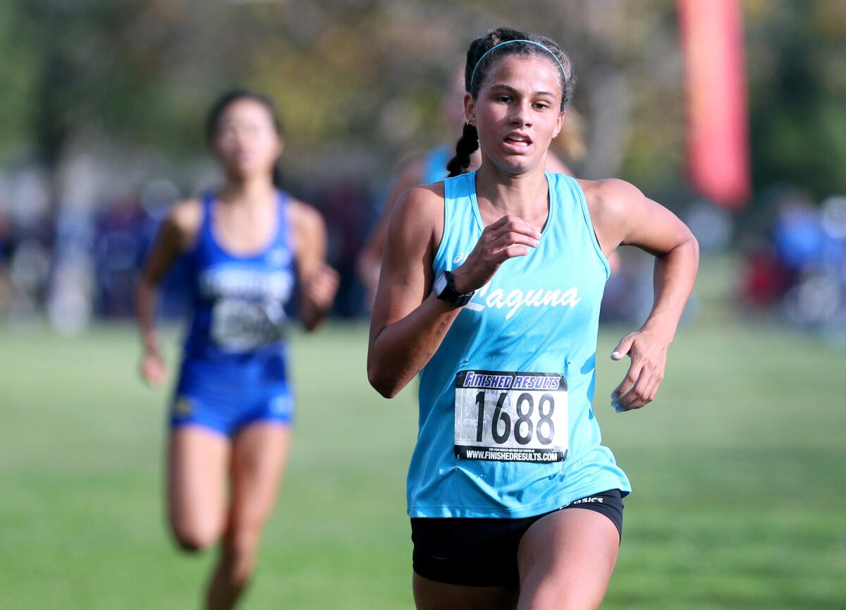 Laguna Beach cross-country runner Jessie Rose wins the varsity girls' combined race in the Sunset Conference cross-country finals at Central Park in Huntington Beach on Nov. 2.