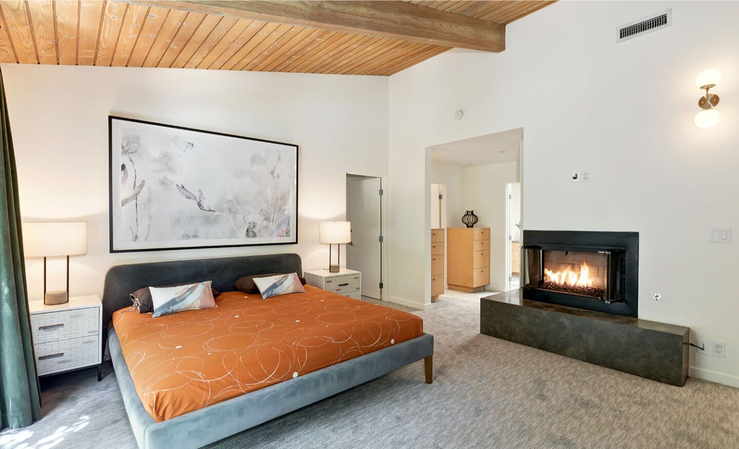 The master bedroom with a fireplace.
