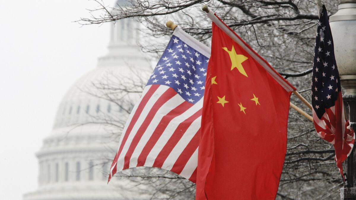 American and Chinese flags are displayed in Washington in 2011.