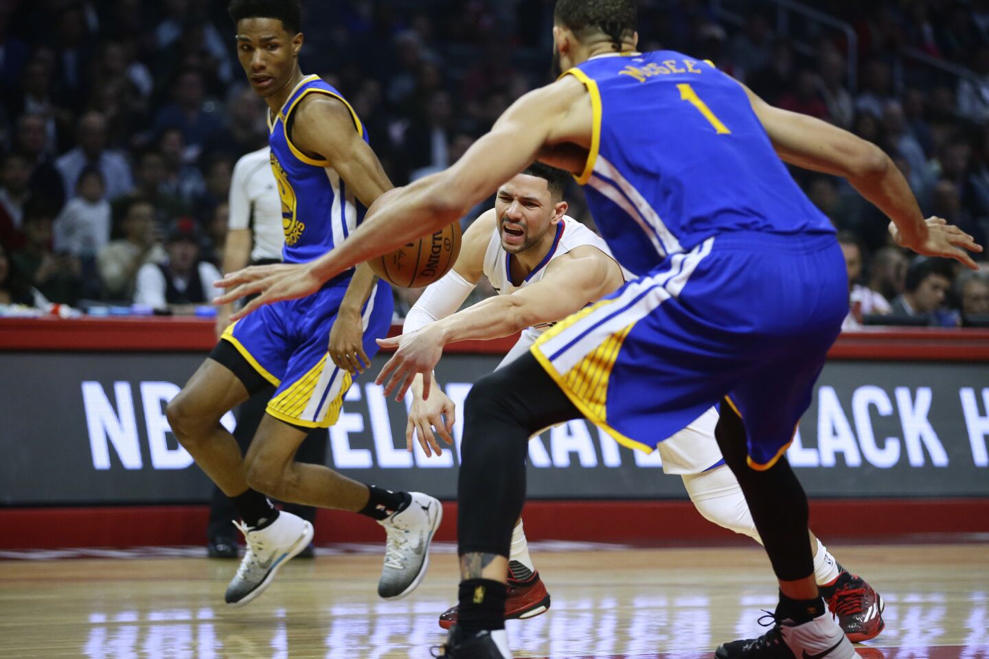 Clippers guard Austin Rivers loses control of the ball while driving against the Warriors during the first half.